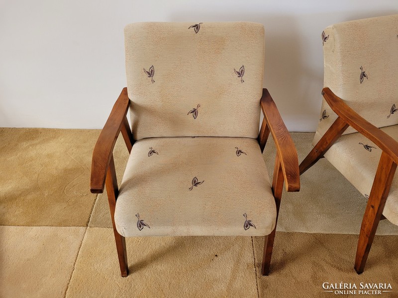 Old retro armchair mid century with wooden arms