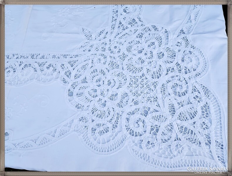 Huge, hand-embroidered, richly patterned, snow-white festive tablecloth