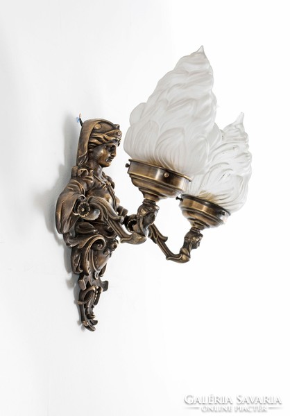 A pair of gilded bronze wall arms with a female figure holding a torch