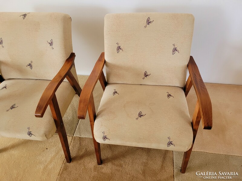 Old retro armchair mid century with wooden arms