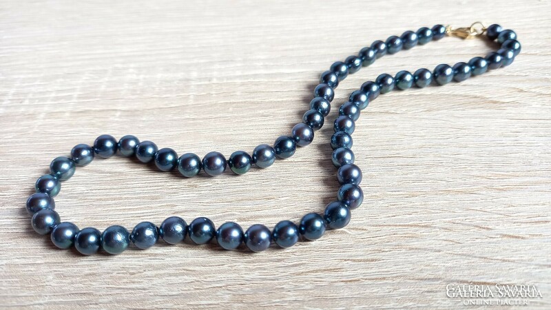 Blue saltwater cultured pearl string with gold fittings