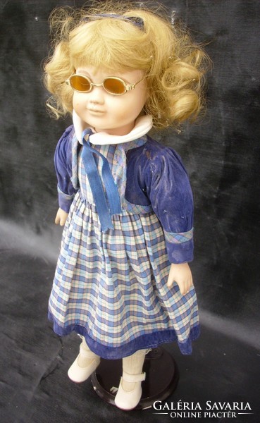 Porcelain head doll with blonde sunglasses