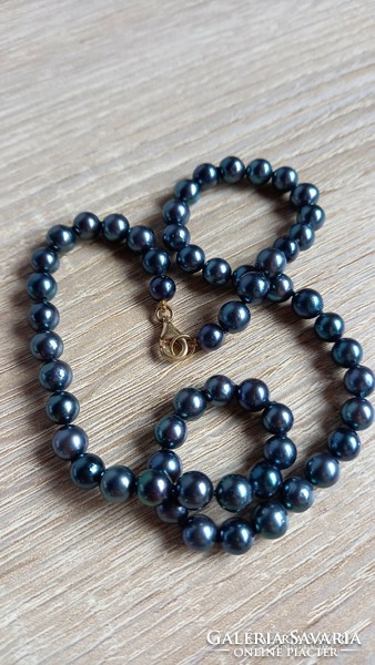 Blue saltwater cultured pearl string with gold fittings