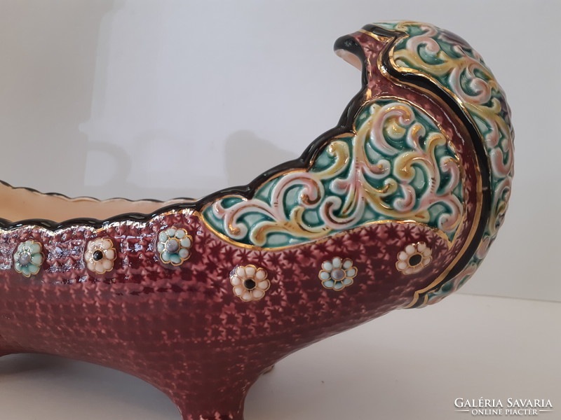 A majolica painted boat-shaped offering bowl standing on four legs