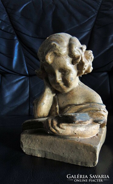 Antique bust of a reading girl