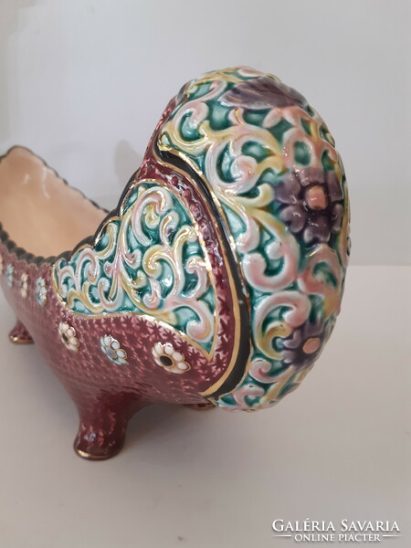 A majolica painted boat-shaped offering bowl standing on four legs