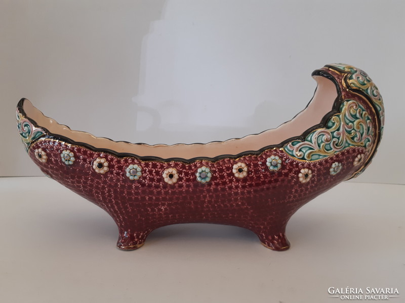 A majolica painted boat-shaped offering bowl standing on four legs