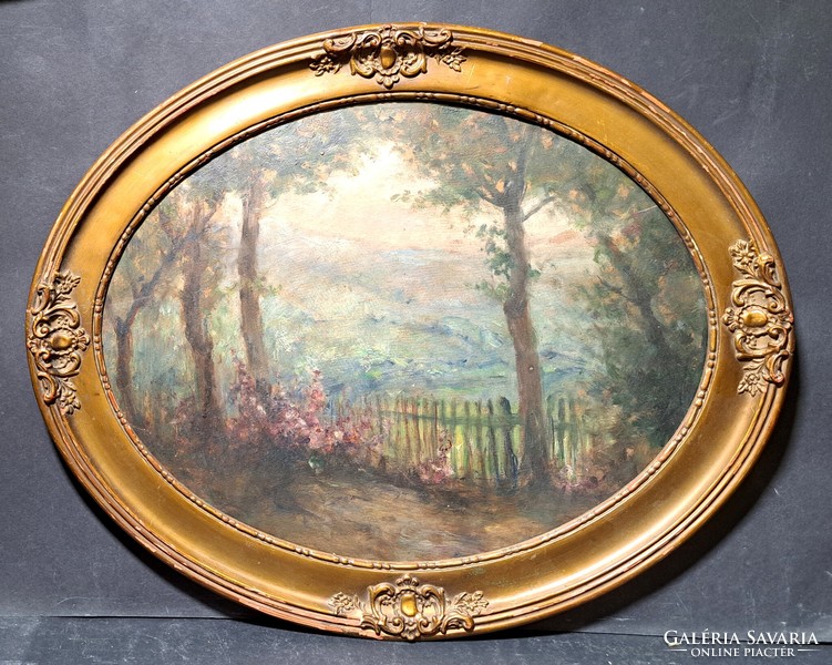 Antique landscape oil painting in an oval frame