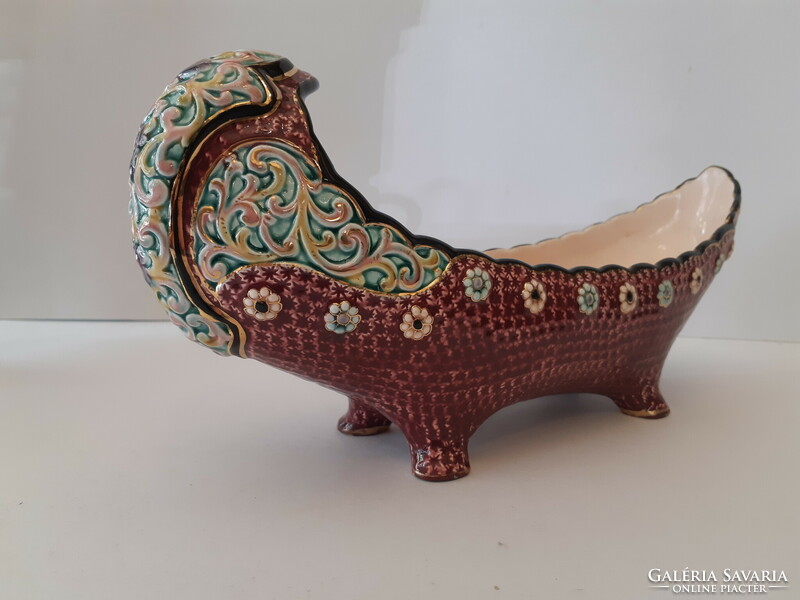 A majolica painted boat-shaped offering bowl standing on four legs