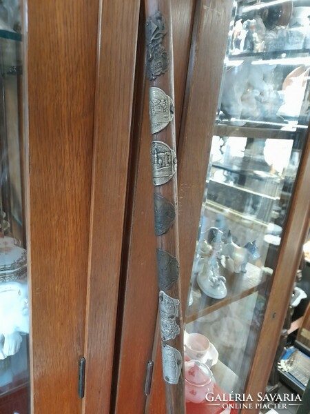 Wooden stick with hiking badge, walking stick. Hiking stick. Walking stick.