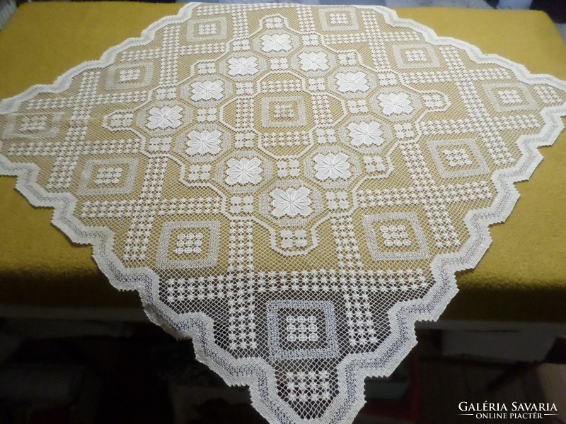 Beautiful beige lace tablecloth.