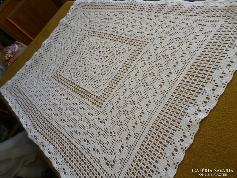 Snow white crocheted lace tablecloth.