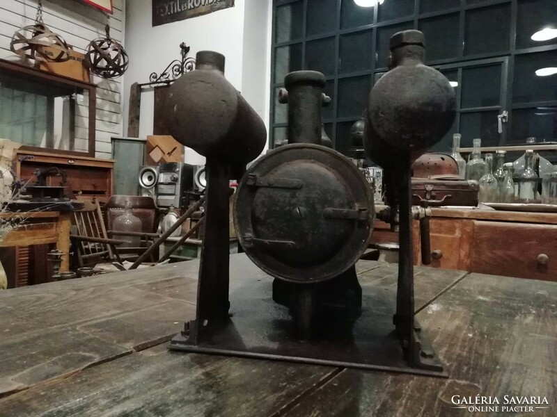 Steam engine boiler, metal boiler, part of an illustrative device, made of iron, a serious solid piece from the beginning of the 20th century
