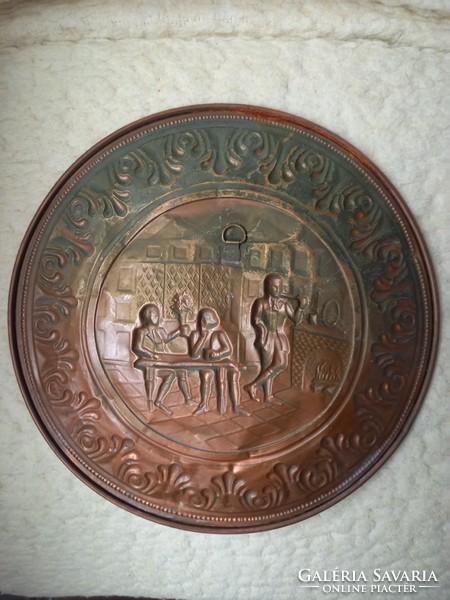 Red copper wall plate with a pub scene