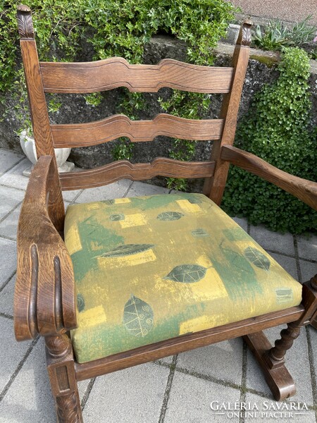 A pair of comfortable old armchairs with canvas covers