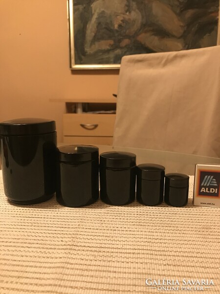 4 black glass jars with screw vinyl lids, they were laboratory glass