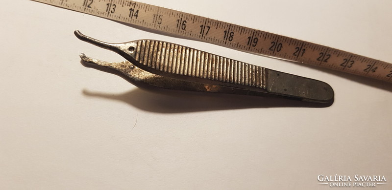 Antique metal tweezers, tool