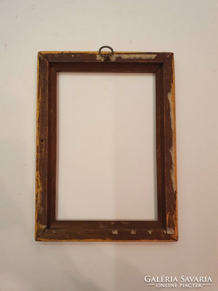 Wooden picture frame with carved pattern. Old.