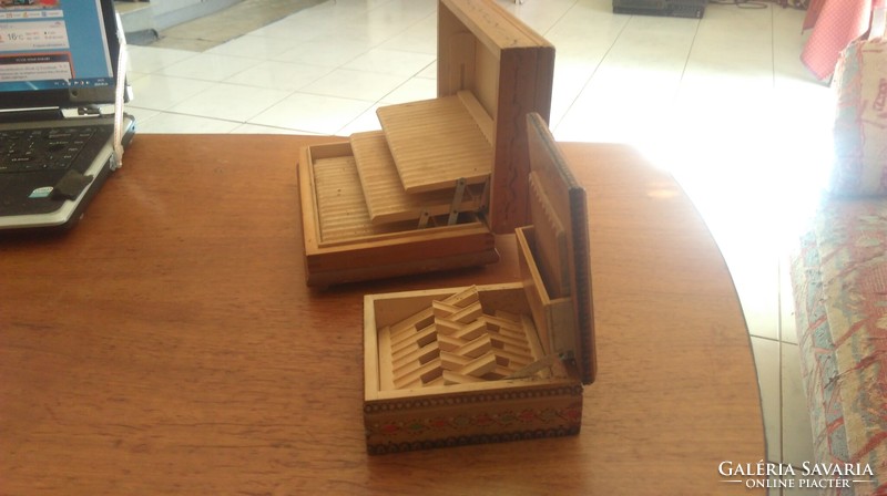 Old cigarette cases in wooden boxes