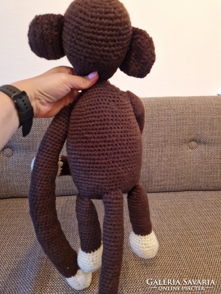 Brown knitted lemur baby