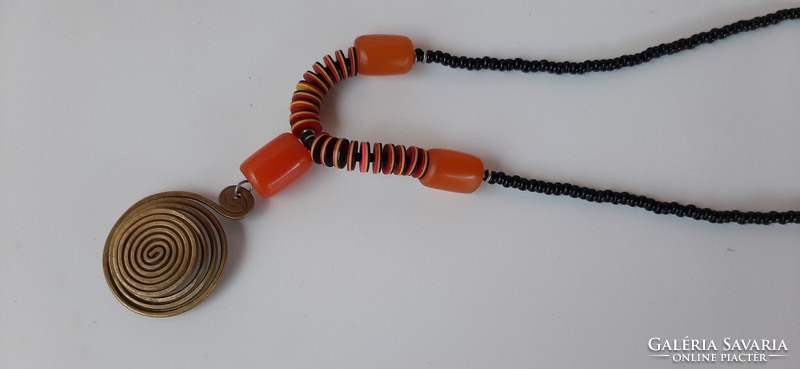 Vintage glass bead string with spiral copper pendant