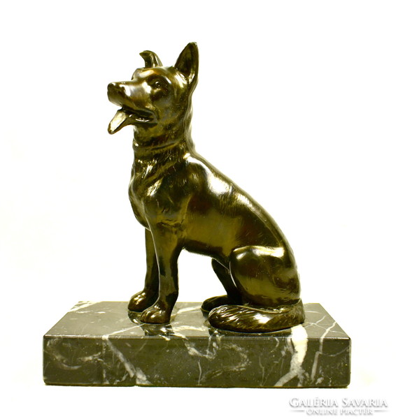 German shepherd - dog statue on a stone plinth