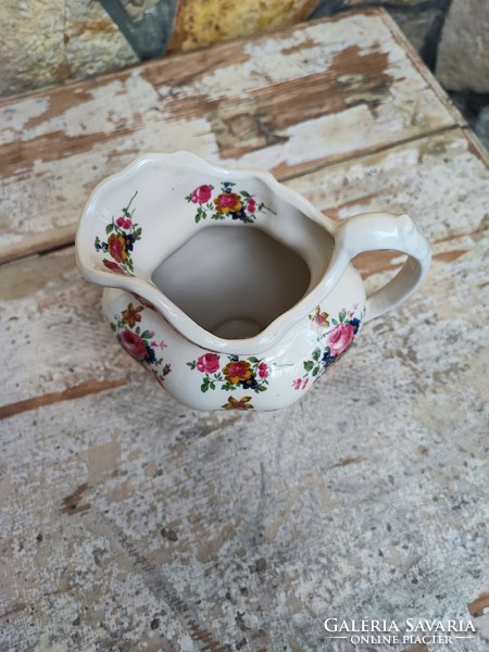 Staffordshire small jug with floral pattern.