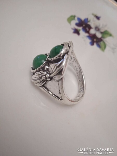 Old bijou ring with green stones.