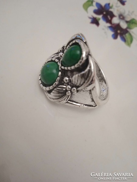 Old bijou ring with green stones.