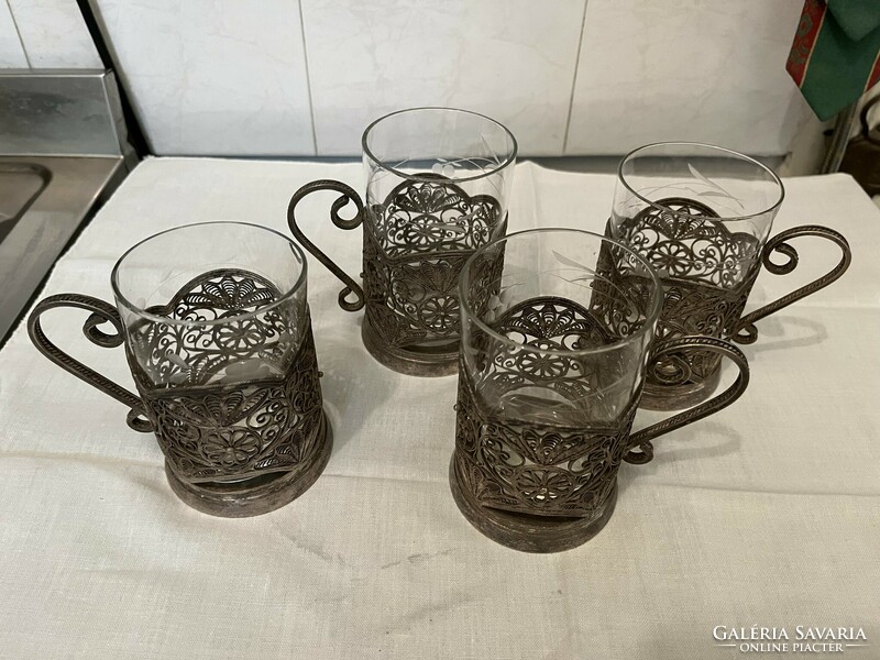 4 cup holders with cut glass glasses