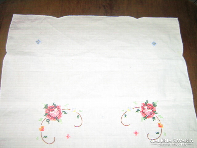 Beautiful pink tablecloth runner embroidered with tiny cross stitches