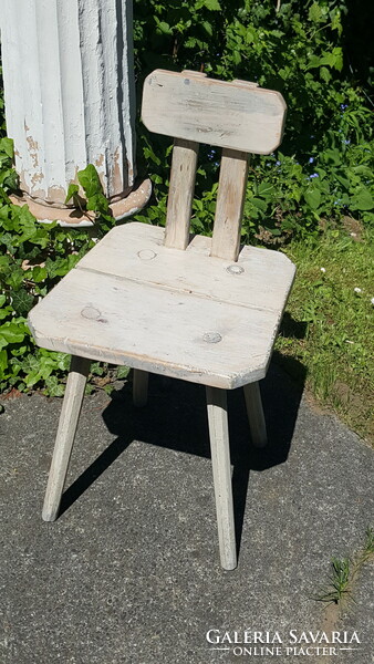 Old, rustic peasant chair, milking chair.