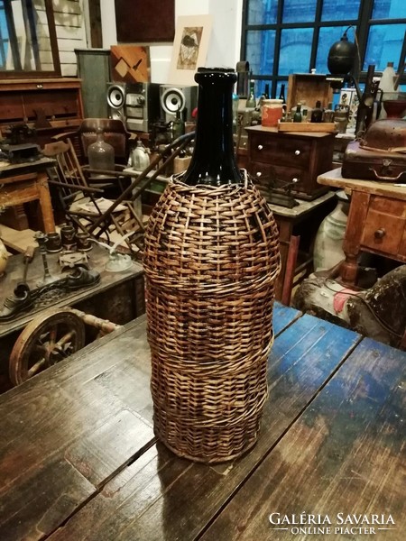 Wicker old glass, perhaps with petroleum in front of it, a wine demizon, large size, for sale as a floor vase