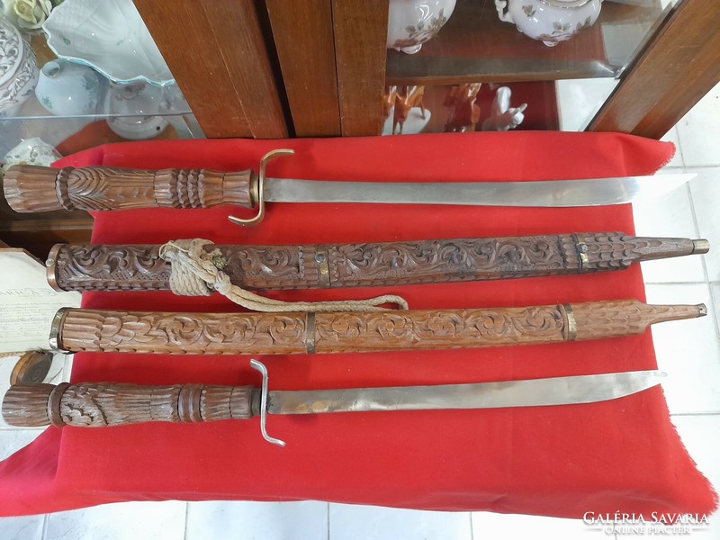 Hand-carved wooden, metal-bladed sword, decorative sword.