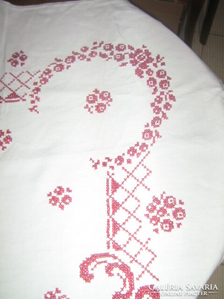A dreamy tablecloth richly embroidered with antique cross stitch