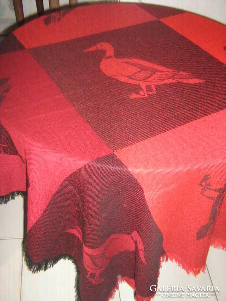 Beautiful duck-patterned fluffy tablecloth in shades of red and black