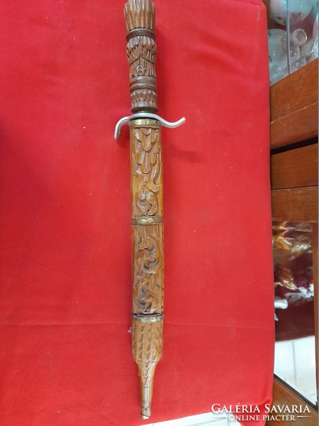 Hand-carved wooden, metal-bladed dagger, sword, decorative sword.