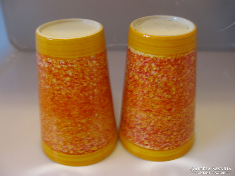 A pair of orange ceramic bowls