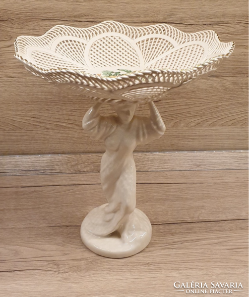Offered with a beautiful openwork, figurative base
