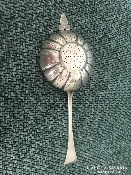 Antique marked silver tea filter spoon.