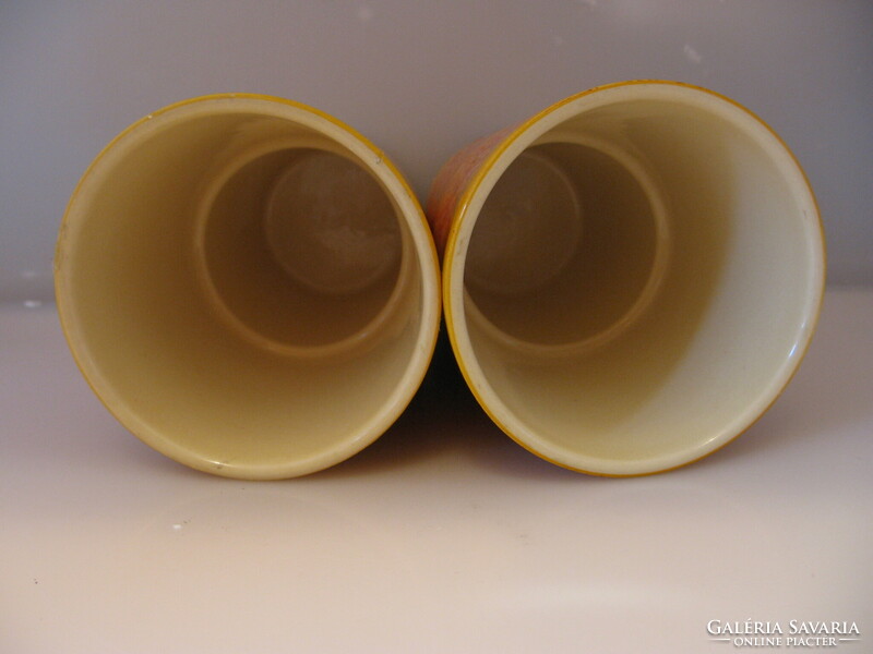 A pair of orange ceramic bowls