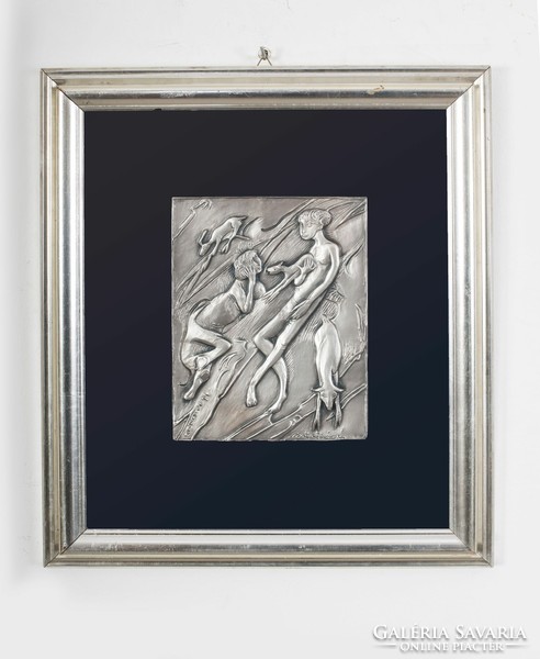 Plastic scene covered with silver plate in a silver frame