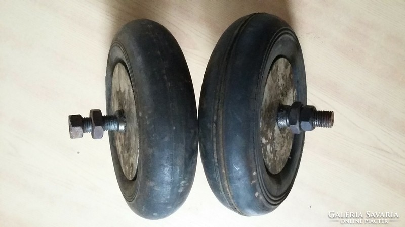 Two old small solid rubber wheels from the attic