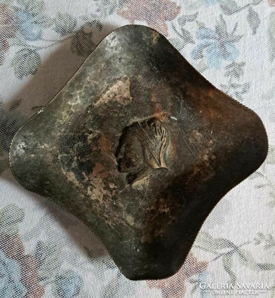 Antique Roman bowl decorated with a female head.