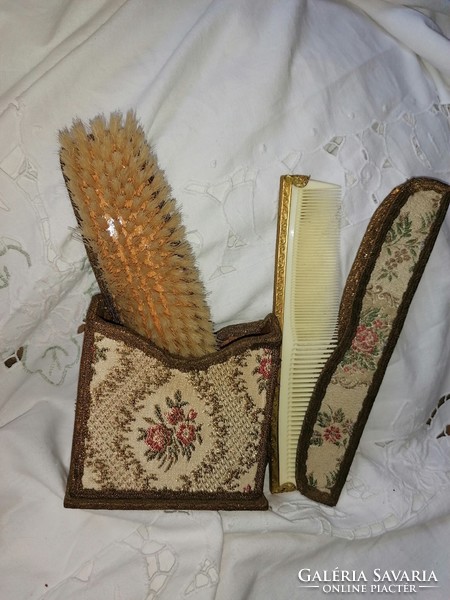 Vintage clothes brush and vinyl comb in their original storage box, still an elegant bathroom decoration.