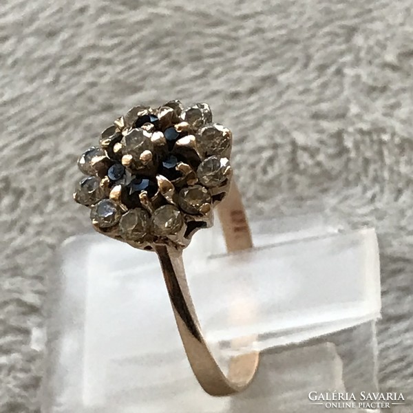 Gold ring with gemstones