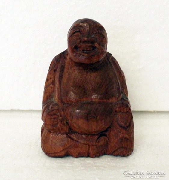 Small carved wooden Buddha statue