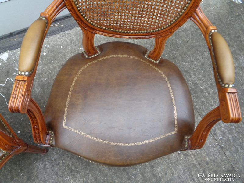 Armchair with leather seat and cane backrest