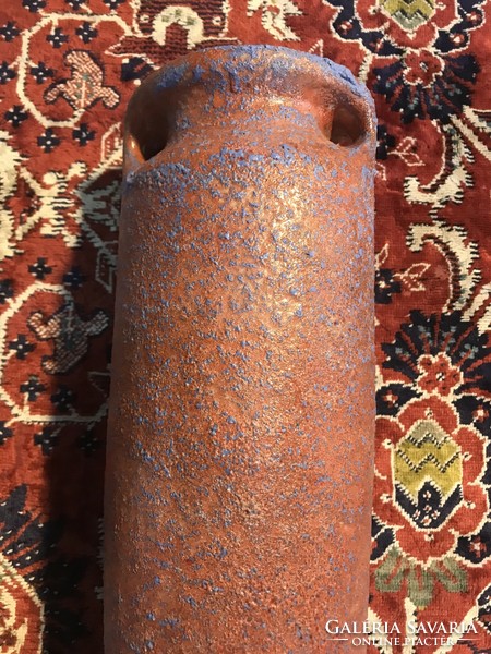 A large ceramic vase with a beautiful bright glaze