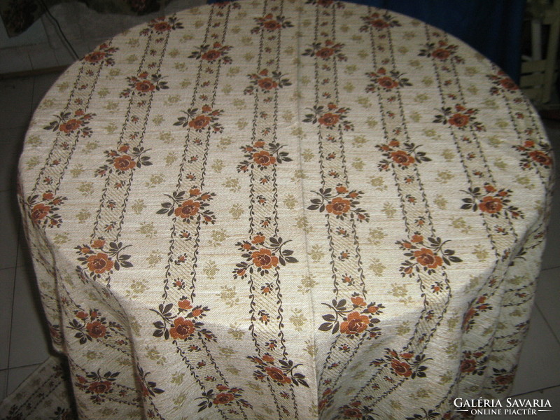 A huge woven tablecloth with a beautiful floral pattern, new